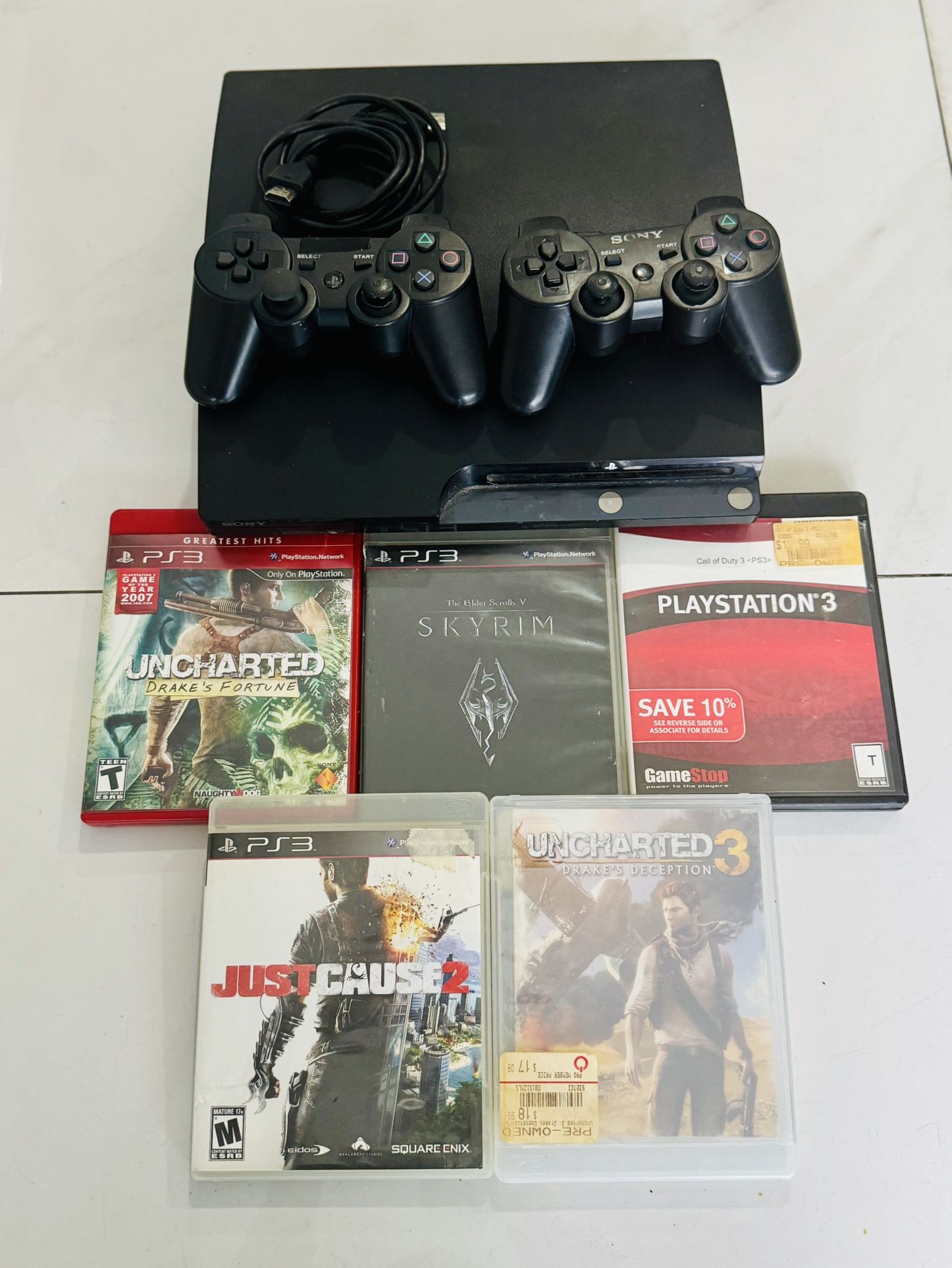 $120 PlayStation 3 con juegos y controles incluidos