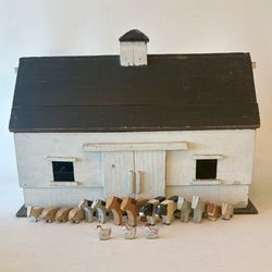 Antique wooden toy barn with wooden animals.  