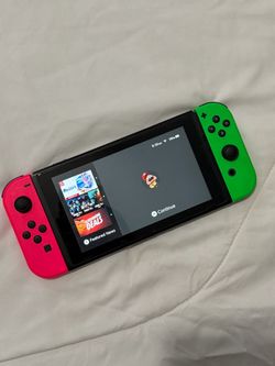 Nintendo Switch with Neon Pink and Green Joy-Cons