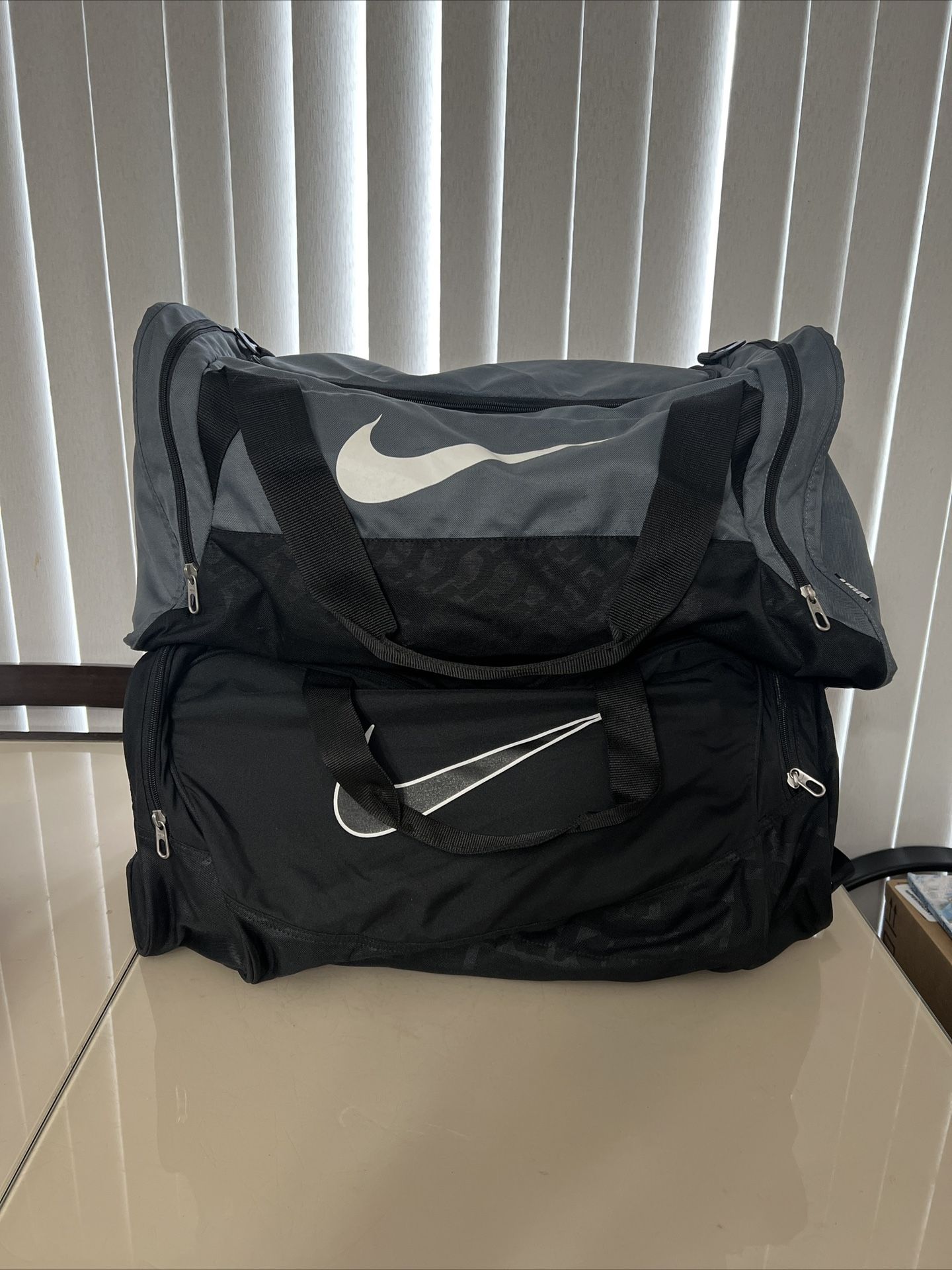 Nike Duffle Gym Medium Bag Black  Shoulder Strap Nike Gray Duffle Bag Lot Of Two. Up for sale these 2 Nike duffle bags. Both are in good cosmetic cond