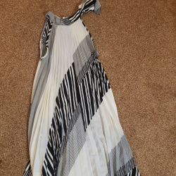 Classy pleated dress. Size: Medium. 100% Polyester. Very light weight, includes lining underneath. White and black with designs. 