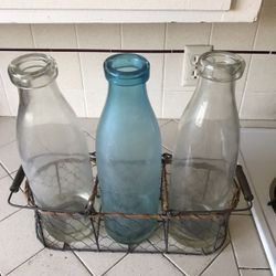 Vintage milk bottles and chicken wire basket