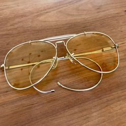 Vintage 1970s Bushnell aviator sunglasses yellow shooting lens 45mm mid size spring ear arms  