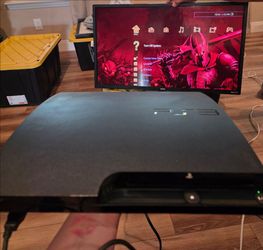 PS3 with one controller, shooting controller and 38 games