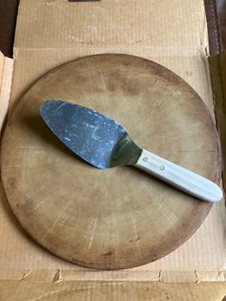 Pampered Chef Pizza Stone—13 inches.