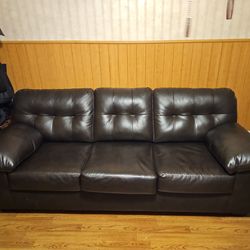 Brown/ Black couch.