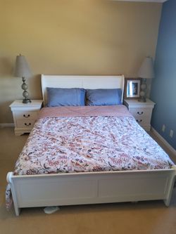 Bedroom set including Queen Bed Frame, Night Stands/End Tables, and dresser drawer with mirror.