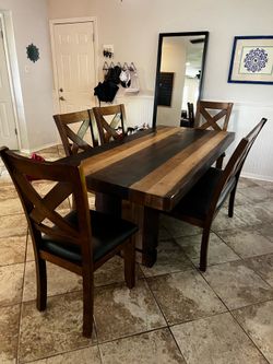 Real wooded butcher block type table with 4 chairs and 1 stool.