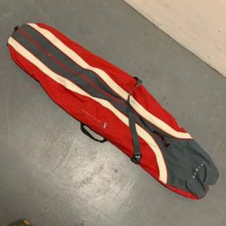 BURTON SNOWBOARDS Travel Carry Bag for Snowboard. Color way is Red Gray Cream  Great pre-owned condition. There is a mark on the bottom of the bag (sh