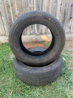 SET OF TWO USED TIRES 245/60/R18.  FIRESTONE ALL SEASON