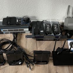 Networking Equipment Lot - 5 Routers, 7 Switches, 2 Wi-Fi Access Points Plus 4 PoE Injectors