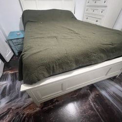 Queen bed frame W/ drawers. Mattress And box Spring 