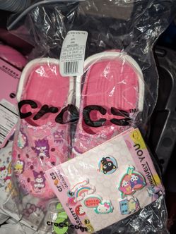 Brand new Hello Kitty Crocs with charms!! Size 4Y fits a Woman's 6!