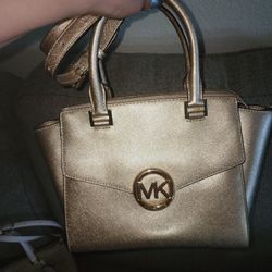 Gold Micheal Kors purse and wallet