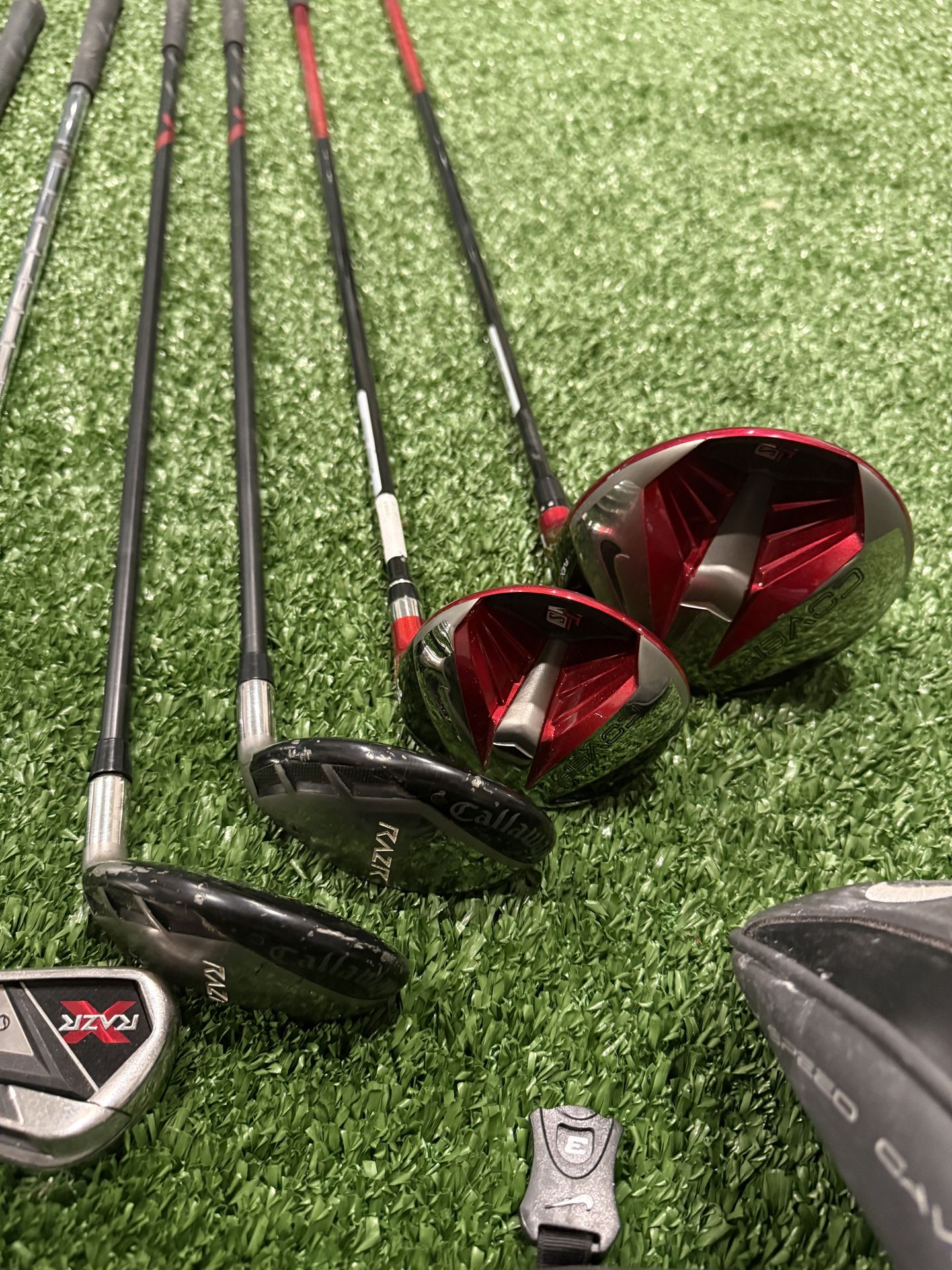 Nike Driver And 3 Wood; Callaway Razr Hybrid And Irons; Ping Putter; Cleveland Wedges