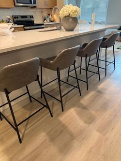 4 grey barstools