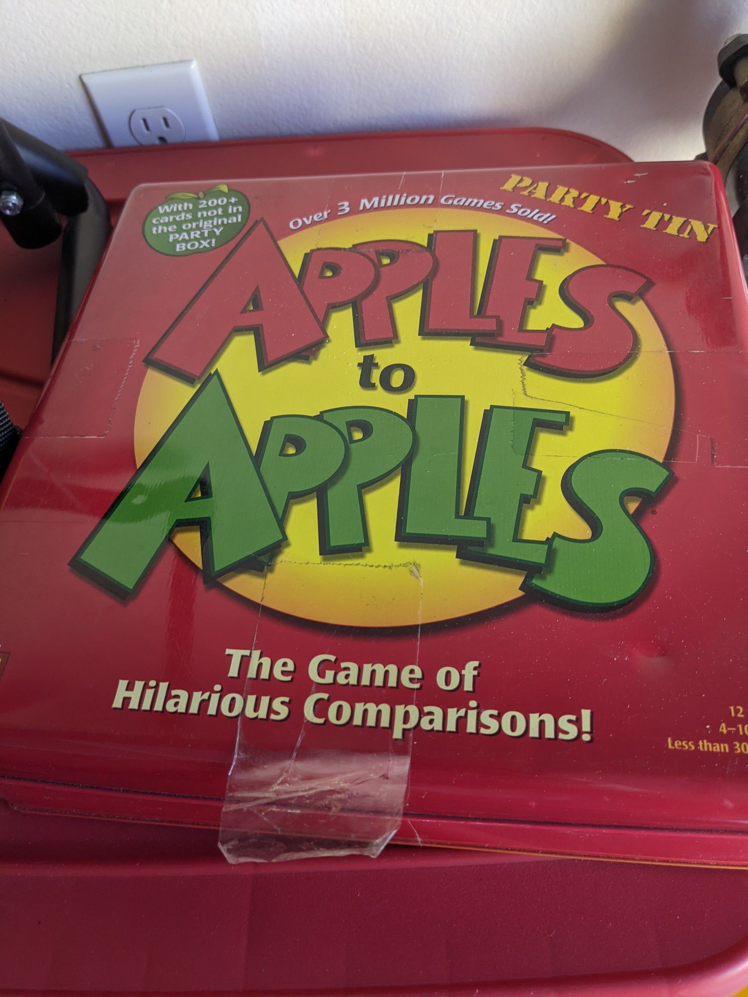 Apples to apples party tin