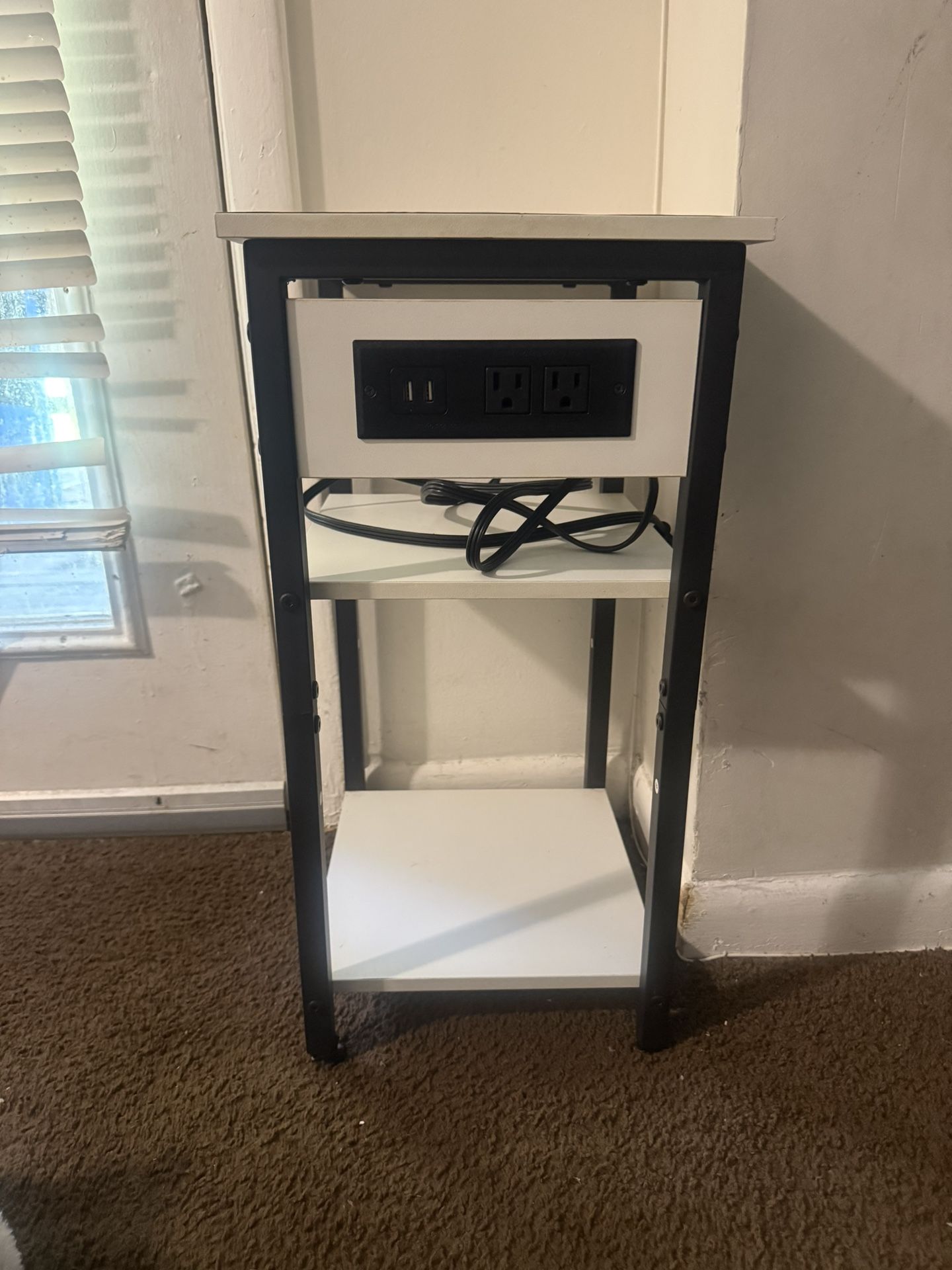 Room night stand that has charging station built in and outlets 