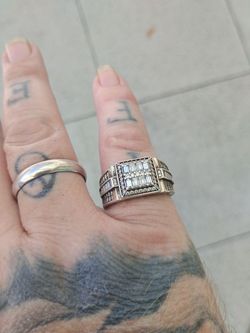 2 silver rings. One with diamonds. Real.