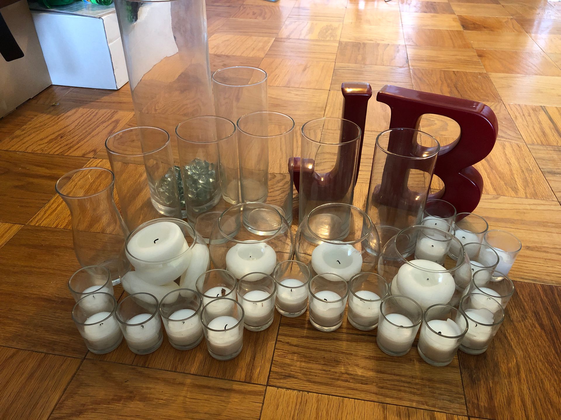 Vases round, votive, tall, and flower weights, candles, and letters