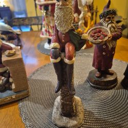 Three vintage santa claus figurines from the nineteen eighties