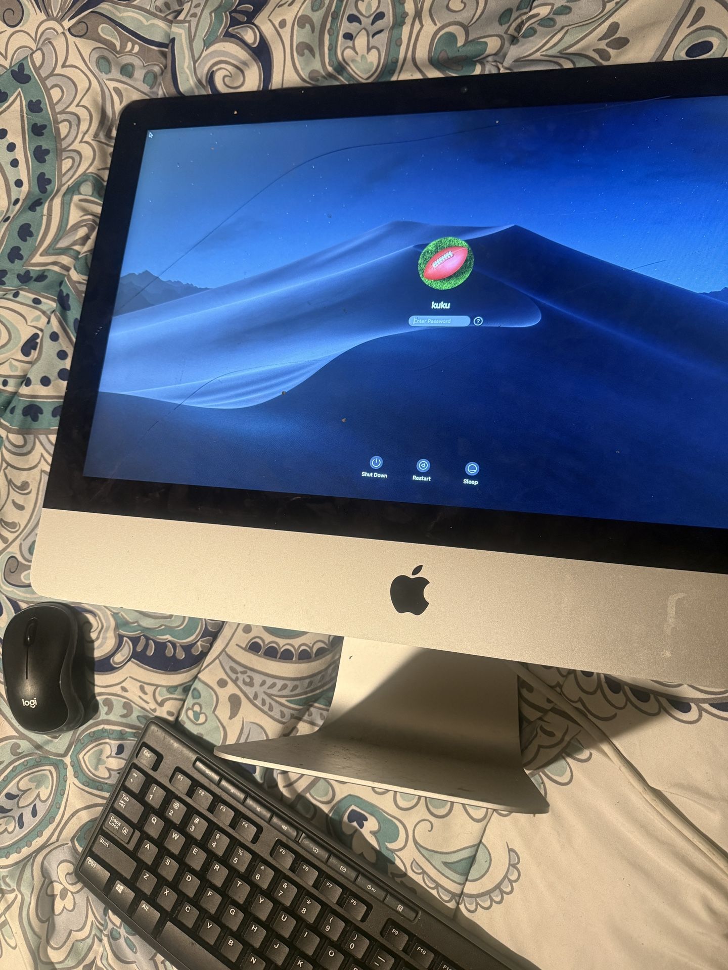 Mac Computer And Logitech Keyboard And Mouse