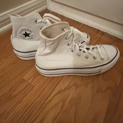 White Chuck Taylor High Tops. 