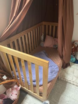 Woden crib and Newton mattress