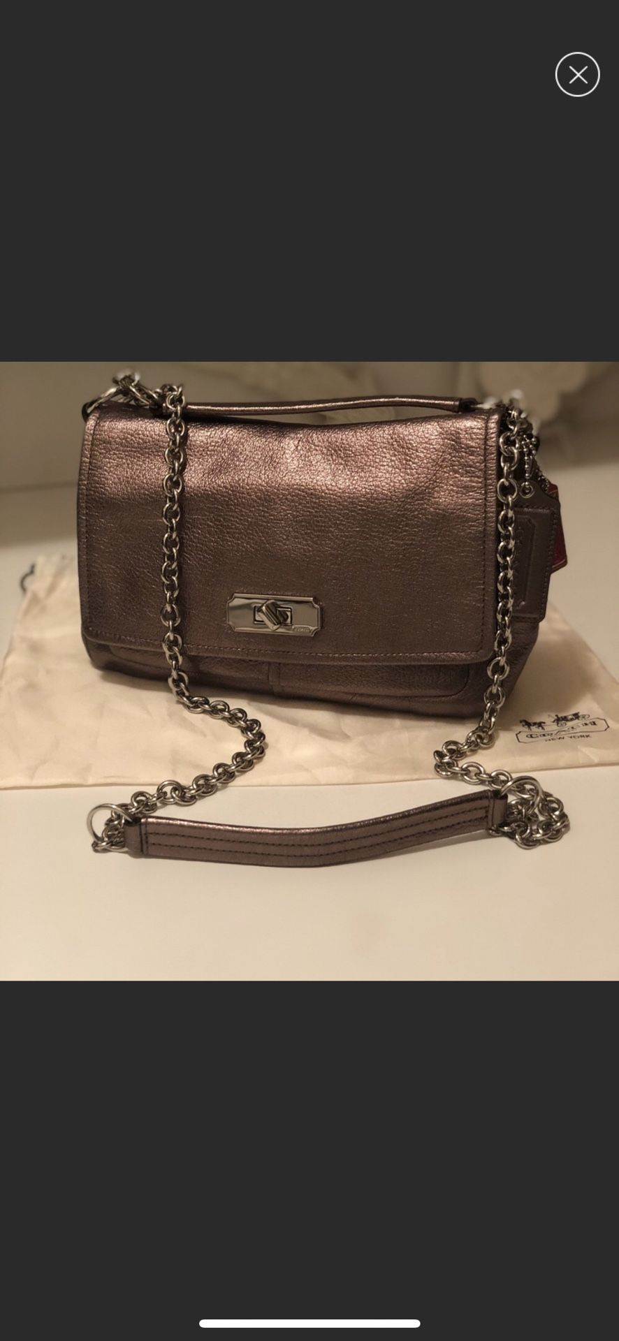 Beautiful coach rose gold crossbody bag with chain . Awesome conditions comes with dust bag . Roomy inside with lots of packets .