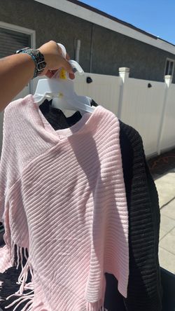 Bin of Knit Fringe Sweater