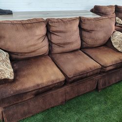 A Set Of Brown Sofas