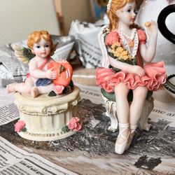 Collection ballerina figurine sitting on a chair.  