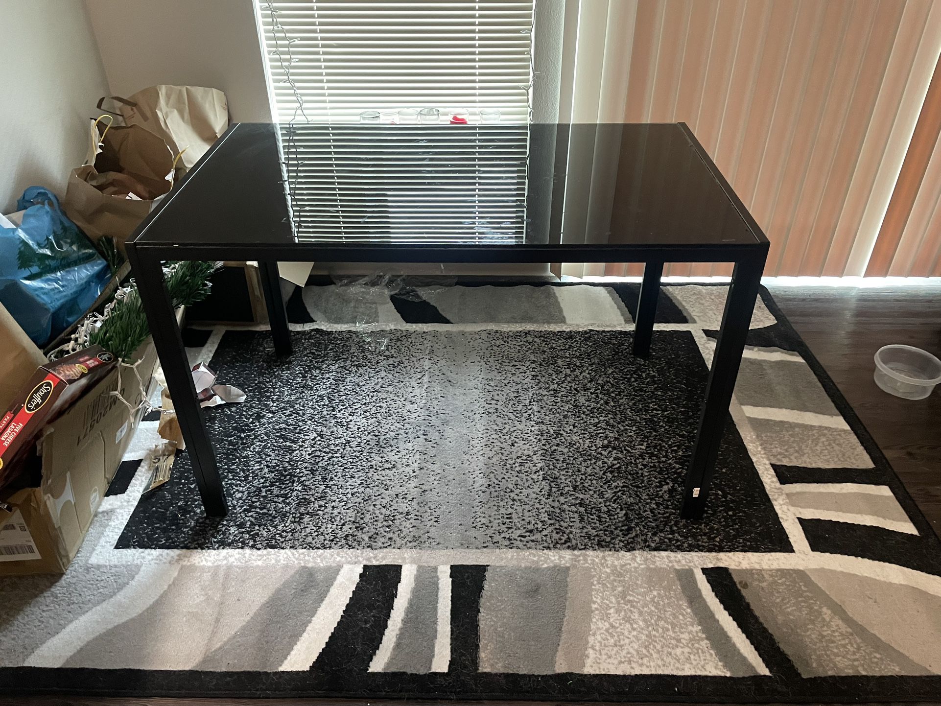 Black Table And Area Rug 