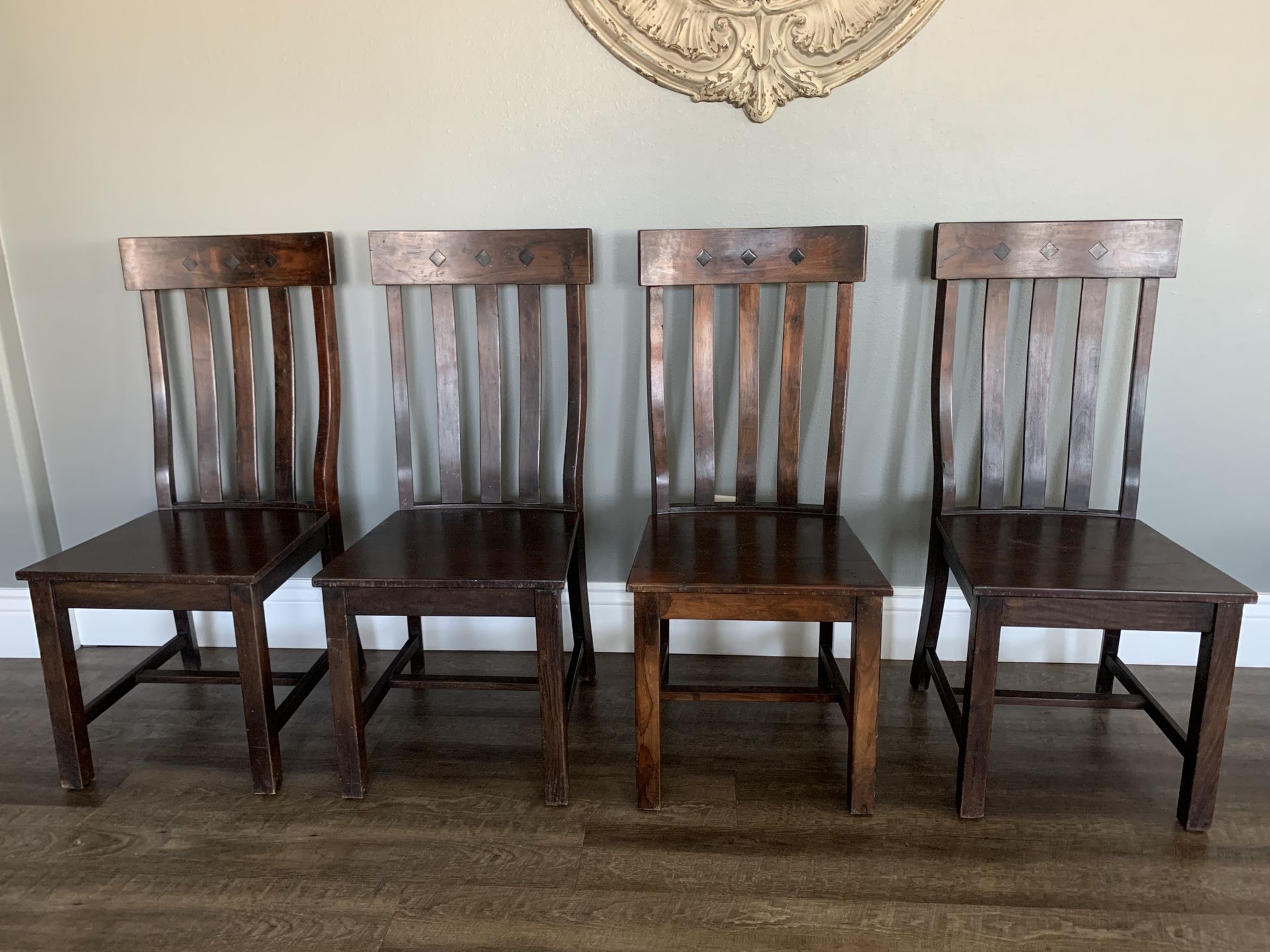 FOUR SOLID DARK WOOD DINING CHAIRS