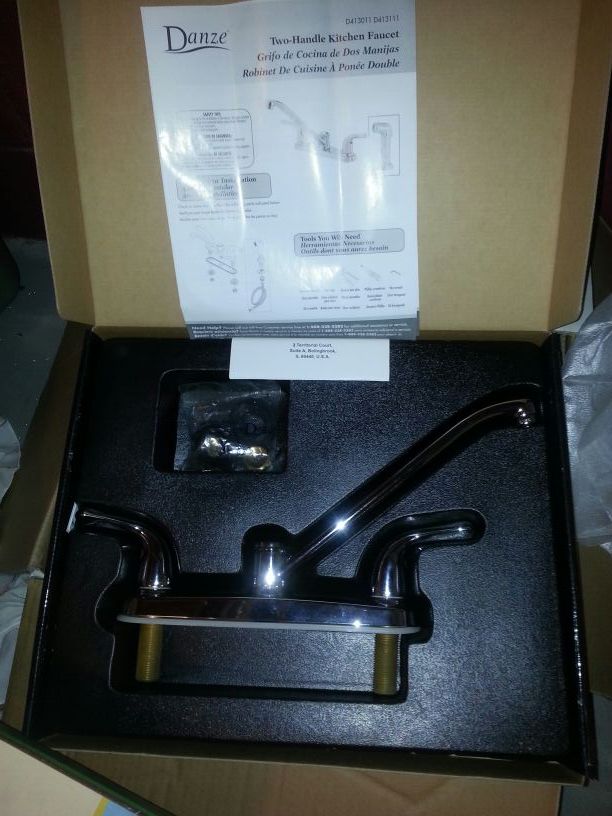 Stainless kitchen faucet. .new in the box