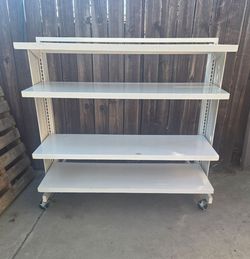 White Metal Shelving Unit on Wheels