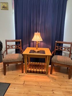 Table, two chairs, and lamp