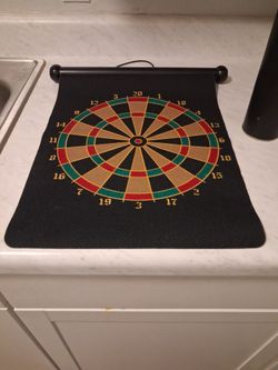Magnetic dart board with hanging string.
