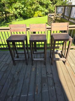 3 wooden bar stools