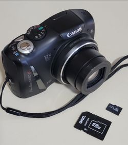 Canon PowerShot SX150 IS 14.1MP Digital Camera With 64GB Memory Card + batteries