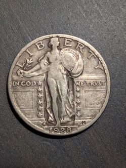 1928s standing silver quarter