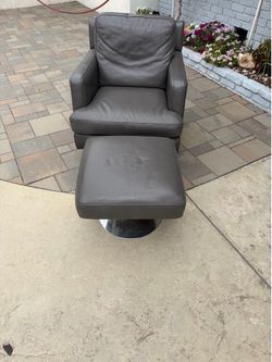 Leather swivel chair and ottoman