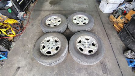 Set Of Four 6 Lug 17" Factory Rims with Tires For $300.