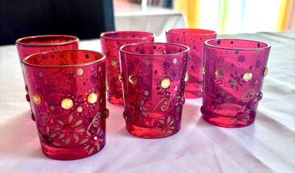 PIER 1 SET OF RED BEJEWELED CANDLE HOLDERS.