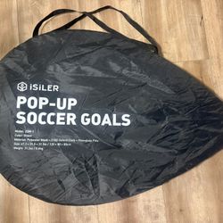 portable iSILER Pop-Up Soccer Goal in its carry bag.