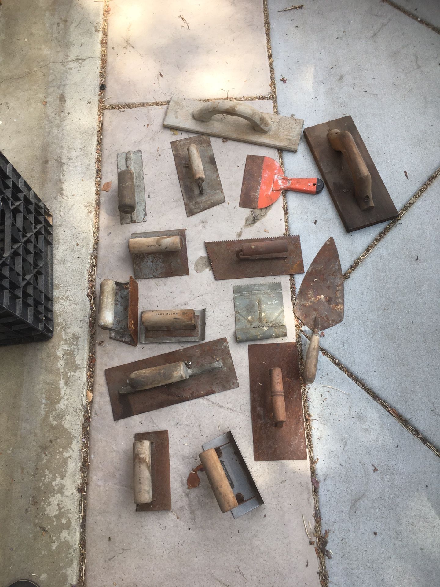 bunch of concrete finishing or mortar tools