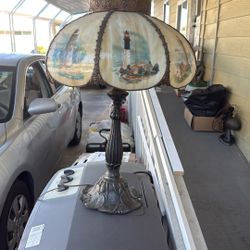 Antique Lamp With Glass Globe With Lighthouses On The Globe