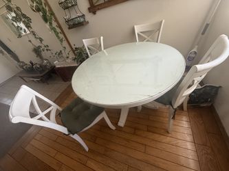 Round white dining table and 4 chairs