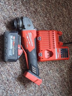 Milwaukee grinder,  battery and battery charger