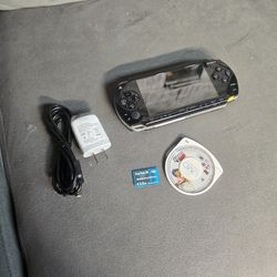 Sony PSP 1001 tested and working with new battery, charger, storage, and game